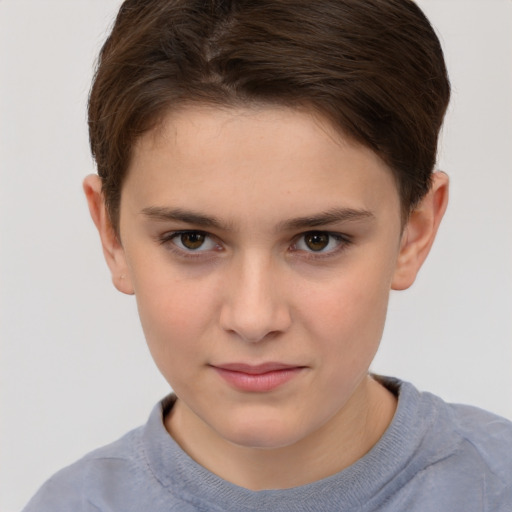 Joyful white child female with short  brown hair and brown eyes