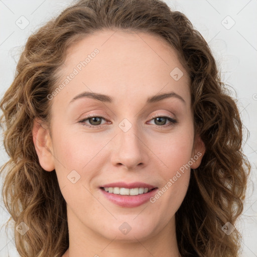 Joyful white young-adult female with long  brown hair and green eyes