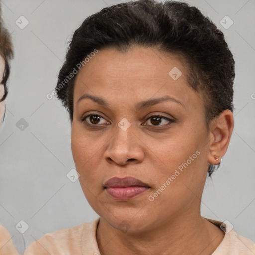 Joyful latino adult female with short  brown hair and brown eyes