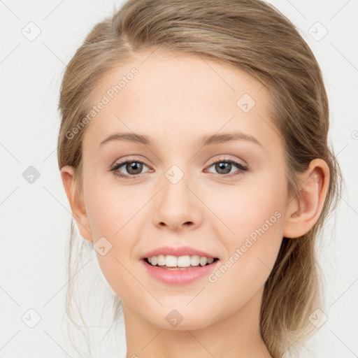 Joyful white young-adult female with medium  brown hair and blue eyes