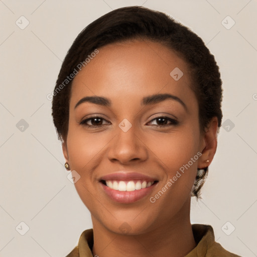 Joyful latino young-adult female with short  brown hair and brown eyes