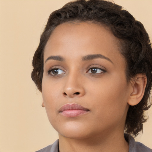 Neutral white young-adult female with short  brown hair and brown eyes