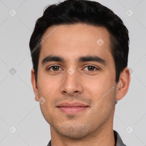 Joyful white young-adult male with short  black hair and brown eyes