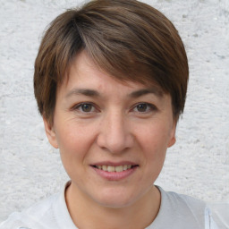 Joyful white adult female with short  brown hair and brown eyes