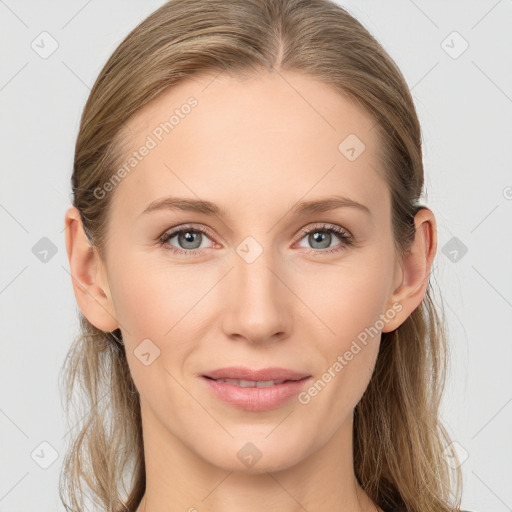 Joyful white young-adult female with medium  brown hair and blue eyes