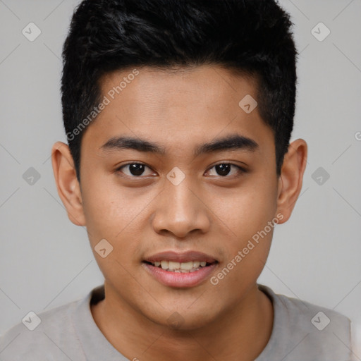 Joyful asian young-adult male with short  black hair and brown eyes