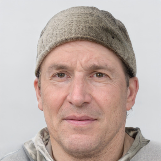 Joyful white middle-aged male with short  brown hair and grey eyes