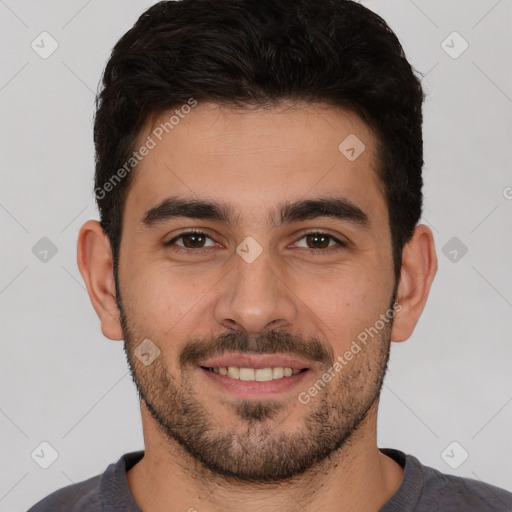 Joyful white young-adult male with short  black hair and brown eyes