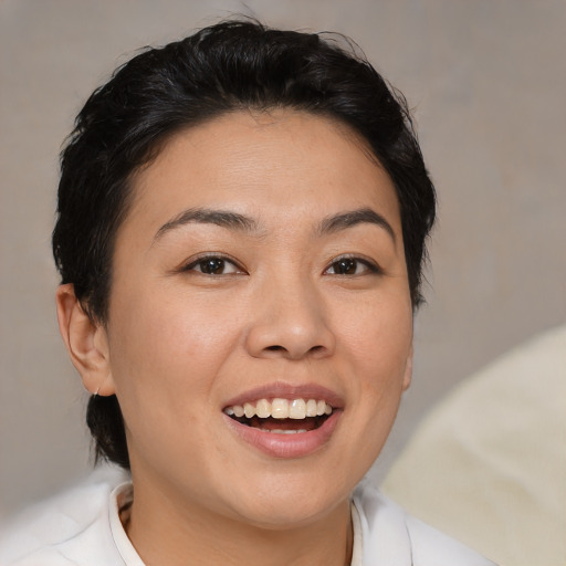 Joyful white young-adult female with medium  brown hair and brown eyes