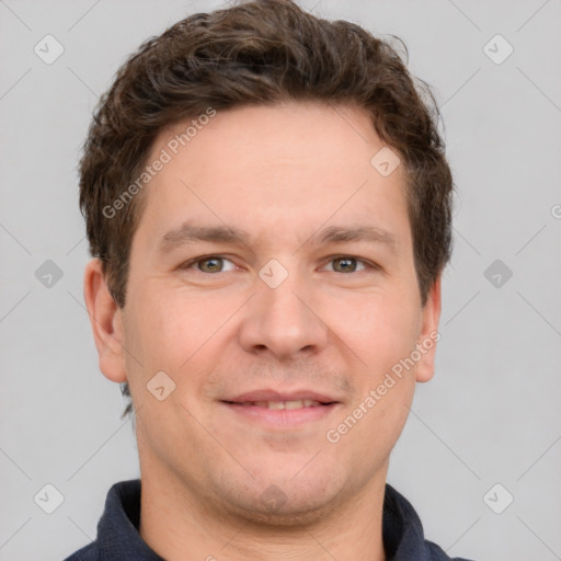 Joyful white adult male with short  brown hair and grey eyes