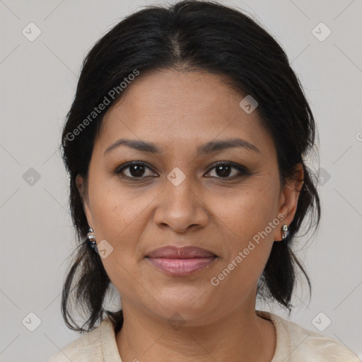 Joyful black adult female with medium  brown hair and brown eyes