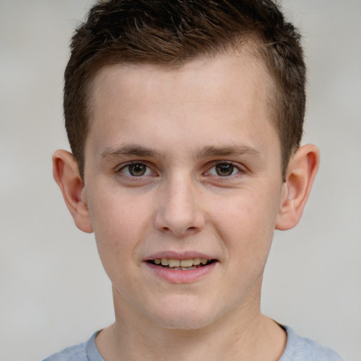 Joyful white child male with short  brown hair and grey eyes