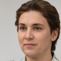 Joyful white adult female with short  brown hair and brown eyes