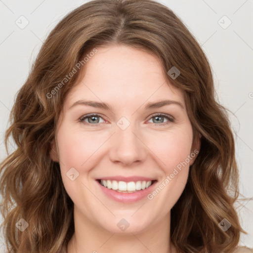 Joyful white young-adult female with long  brown hair and green eyes