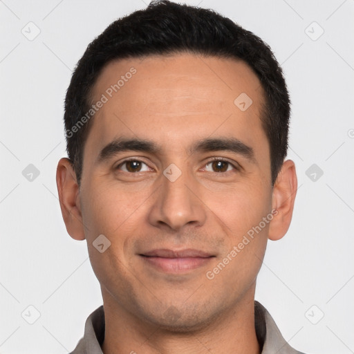 Joyful white young-adult male with short  black hair and brown eyes