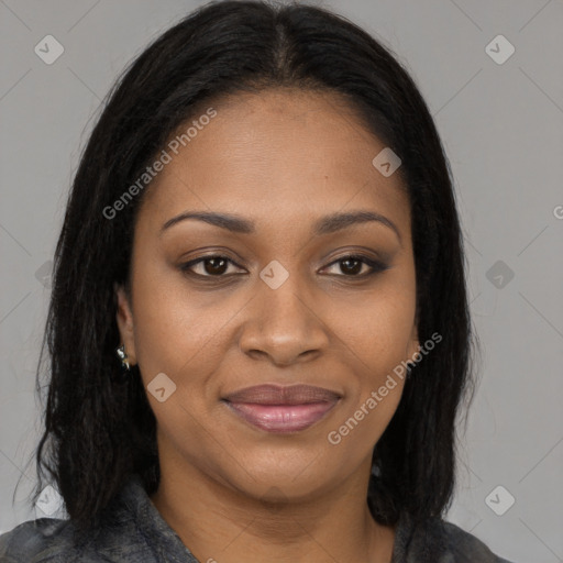 Joyful black young-adult female with long  brown hair and brown eyes