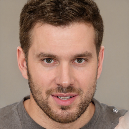 Joyful white young-adult male with short  brown hair and brown eyes