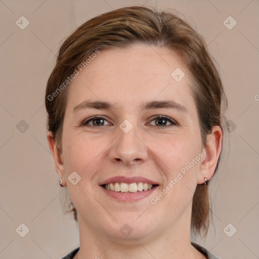 Joyful white young-adult female with medium  brown hair and grey eyes