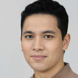 Joyful asian young-adult male with short  black hair and brown eyes