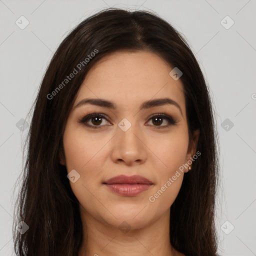 Joyful latino young-adult female with long  brown hair and brown eyes