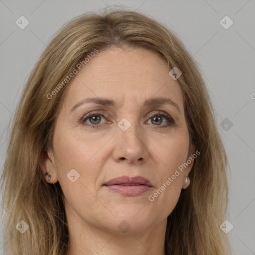 Joyful white adult female with long  brown hair and brown eyes