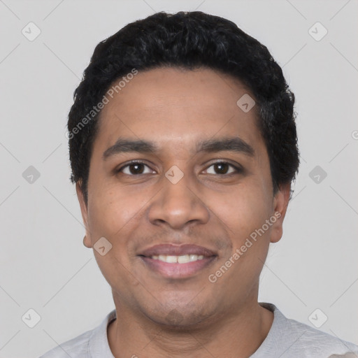 Joyful latino young-adult male with short  black hair and brown eyes