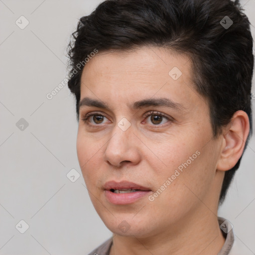 Joyful white adult male with short  brown hair and brown eyes