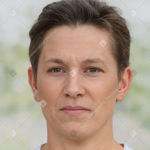 Joyful white adult female with short  brown hair and brown eyes