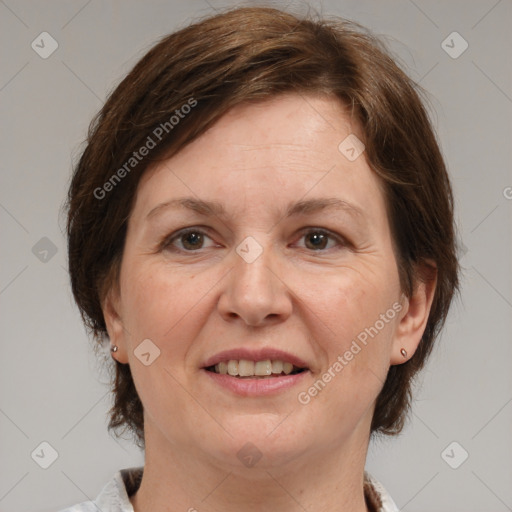 Joyful white adult female with medium  brown hair and grey eyes