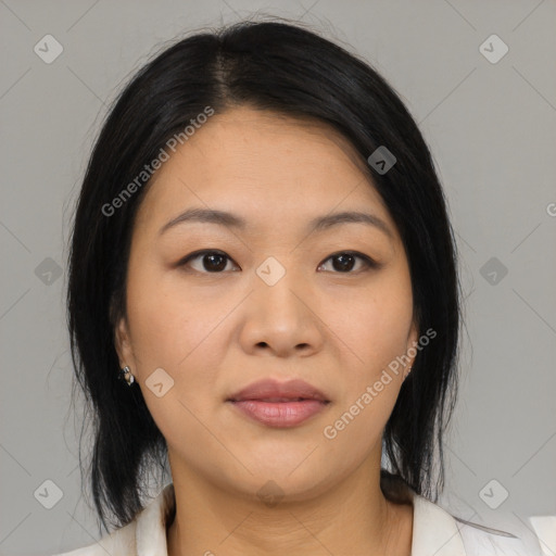 Joyful asian young-adult female with medium  black hair and brown eyes