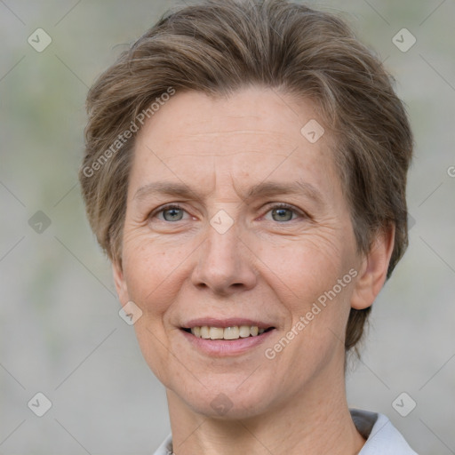 Joyful white adult female with short  brown hair and grey eyes