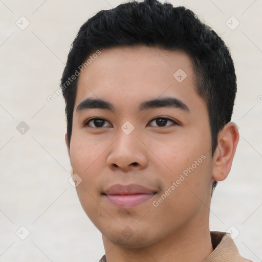 Joyful asian young-adult male with short  black hair and brown eyes