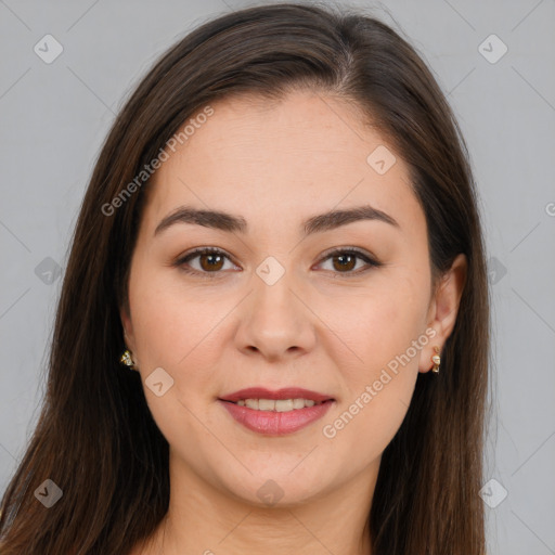 Joyful white young-adult female with long  brown hair and brown eyes