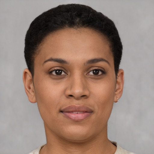 Joyful latino young-adult female with short  brown hair and brown eyes