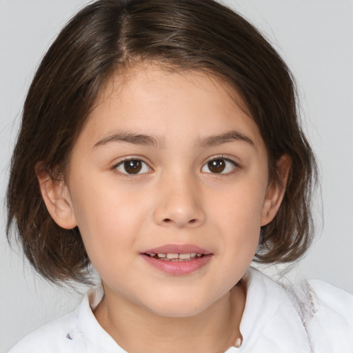 Joyful white child female with medium  brown hair and brown eyes