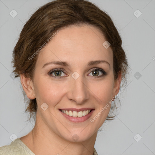 Joyful white young-adult female with medium  brown hair and green eyes