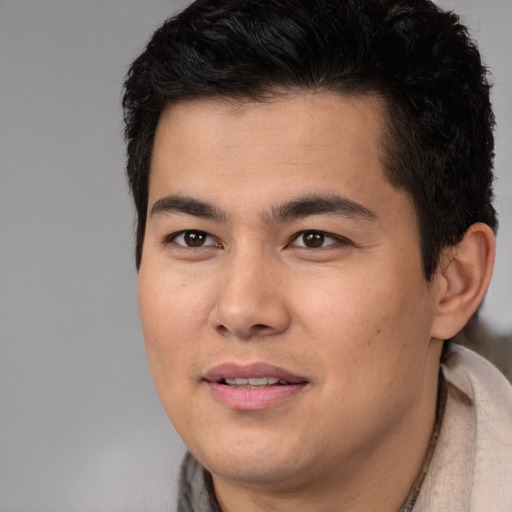 Joyful latino young-adult male with short  brown hair and brown eyes