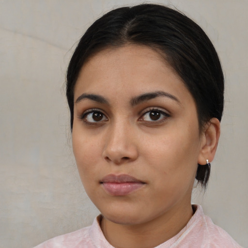Neutral latino young-adult female with medium  black hair and brown eyes