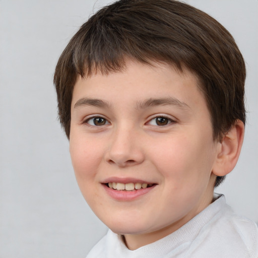 Joyful white child female with short  brown hair and brown eyes