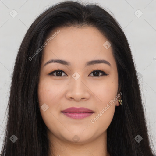 Joyful asian young-adult female with long  brown hair and brown eyes