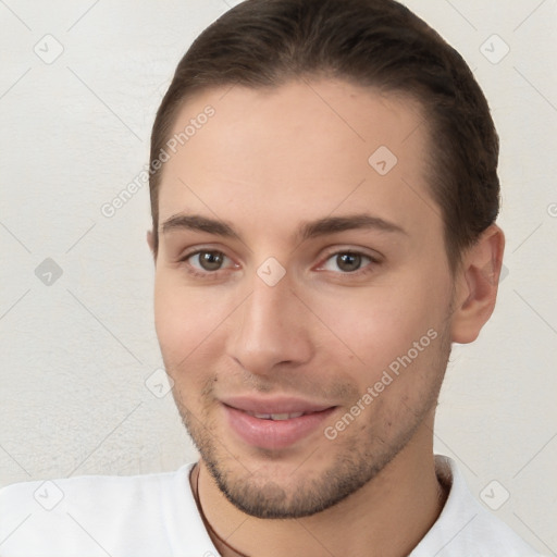 Joyful white young-adult male with short  brown hair and brown eyes