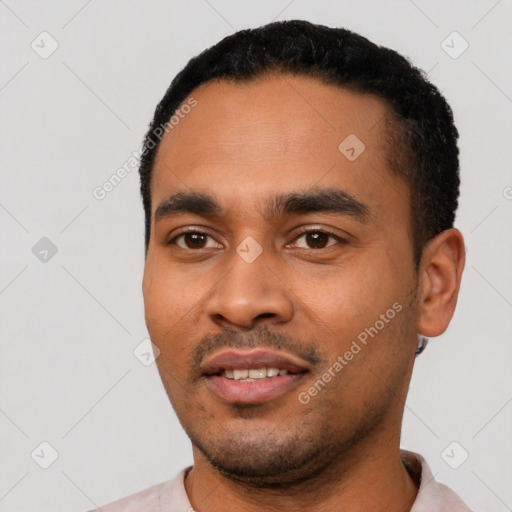 Joyful latino young-adult male with short  black hair and brown eyes