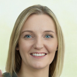 Joyful white young-adult female with long  brown hair and green eyes