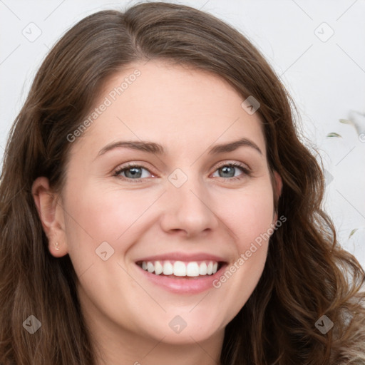 Joyful white young-adult female with long  brown hair and green eyes