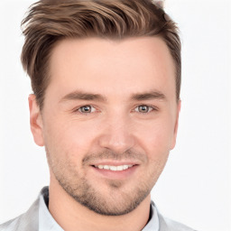 Joyful white young-adult male with short  brown hair and grey eyes