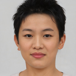 Joyful asian young-adult female with short  brown hair and brown eyes