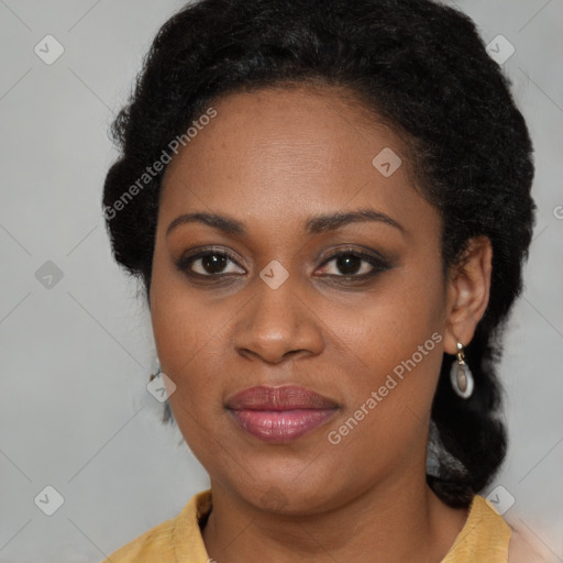 Joyful black young-adult female with long  brown hair and brown eyes