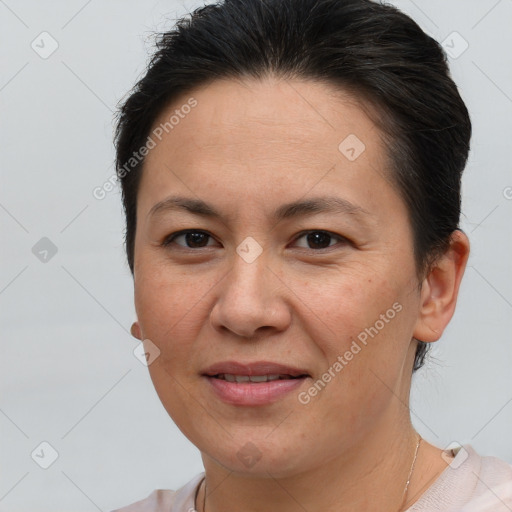 Joyful white adult female with short  brown hair and brown eyes