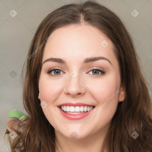 Joyful white young-adult female with medium  brown hair and green eyes