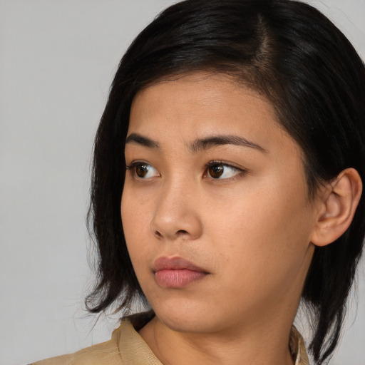 Neutral asian young-adult female with medium  black hair and brown eyes
